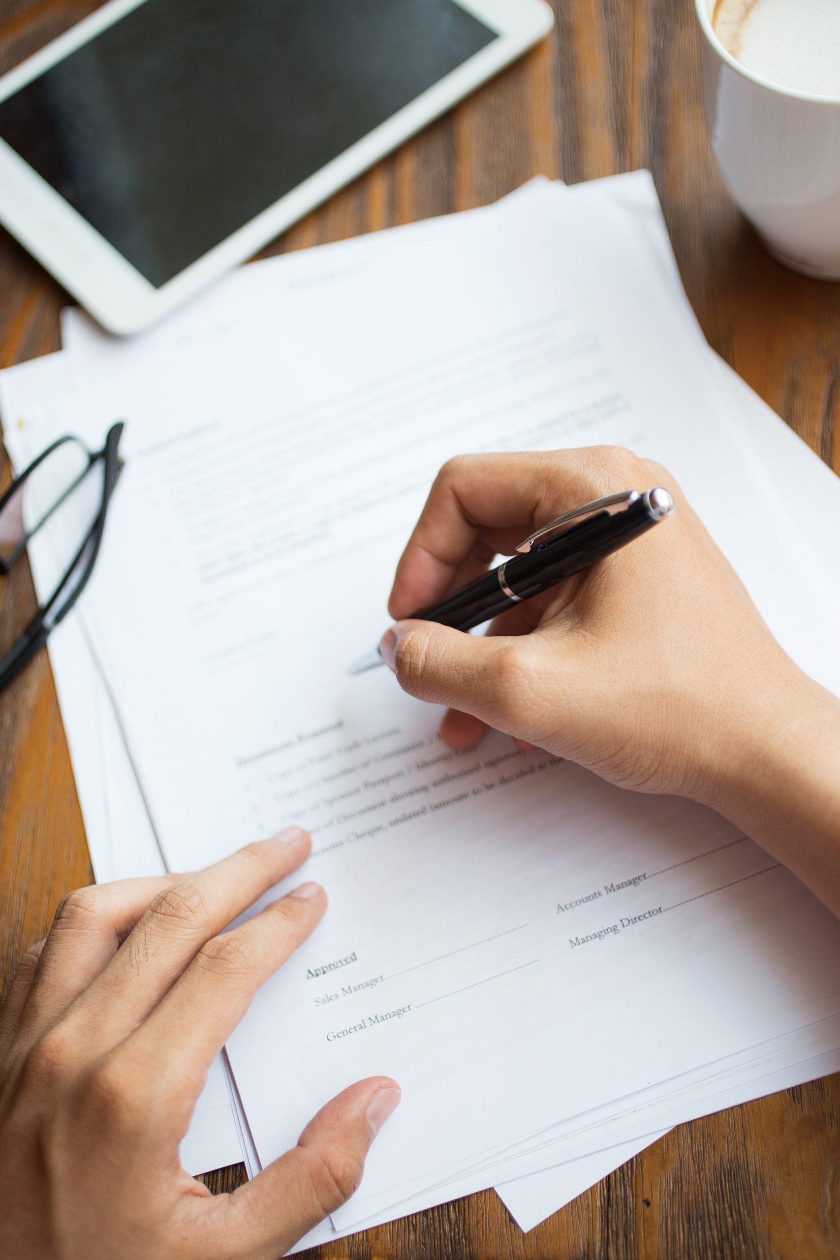 Unrecognizable man filling application form Unrecognizable man filling application form. Businessman checking papers. He signing document. Manager working with report. Financial report concept